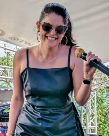 Kay singing on stage with Zombie University